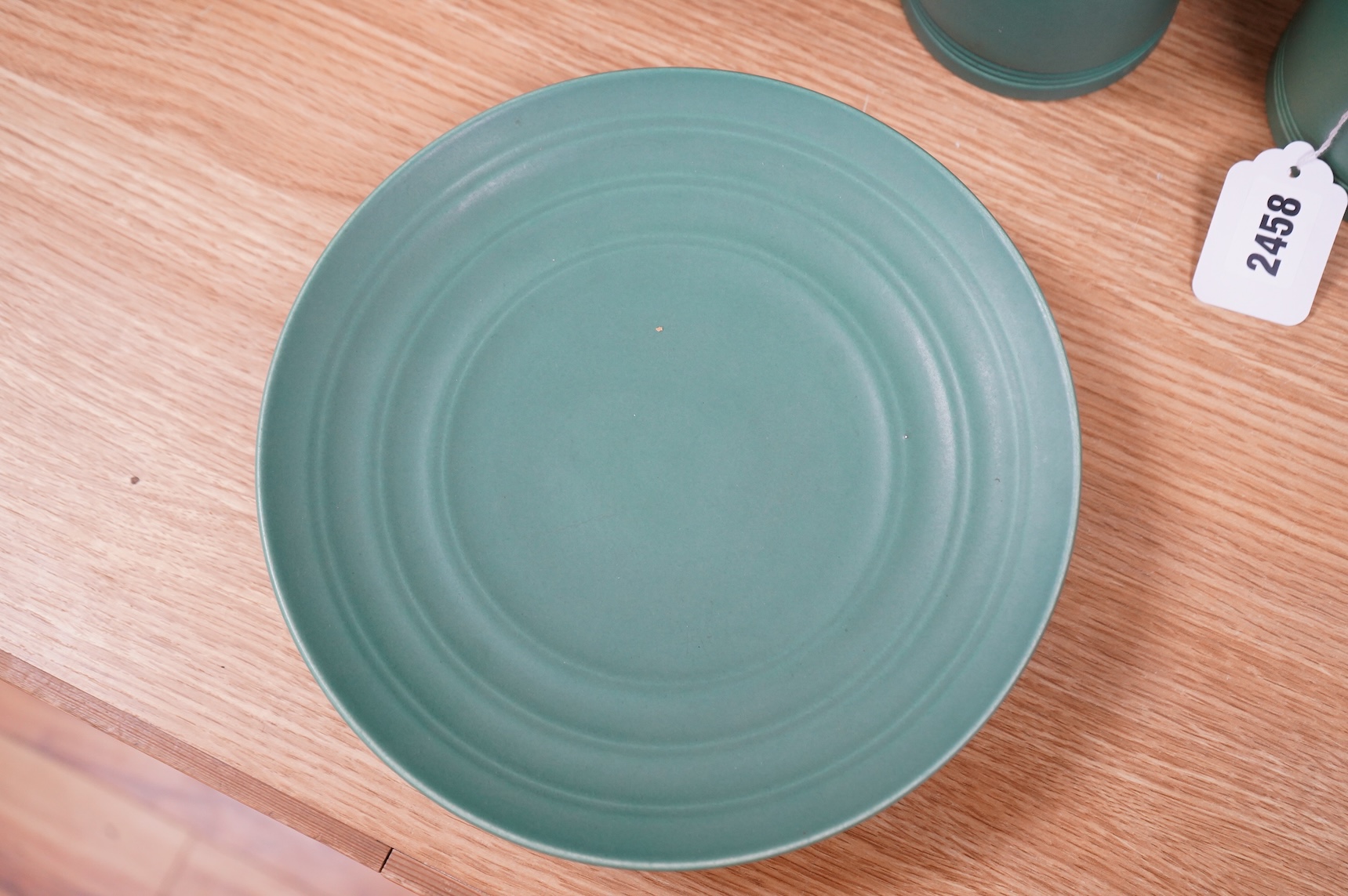 Keith Murray for Wedgwood, a green glazed ribbed tazza or footed dish, 23cm in diameter
